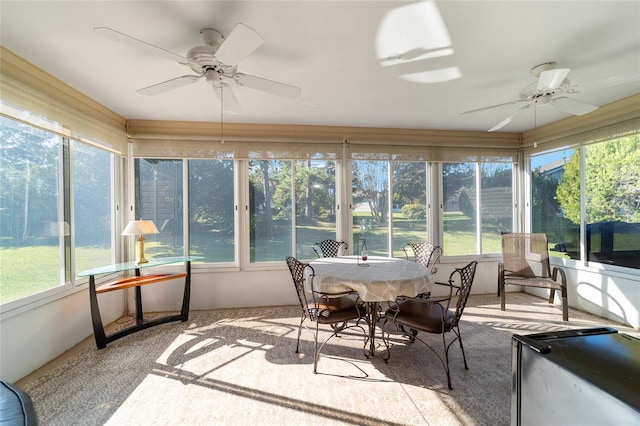 sunroom with ceiling fan and a healthy amount of sunlight