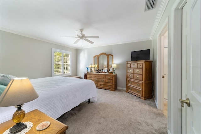 bedroom featuring ceiling fan, ornamental molding, and light carpet