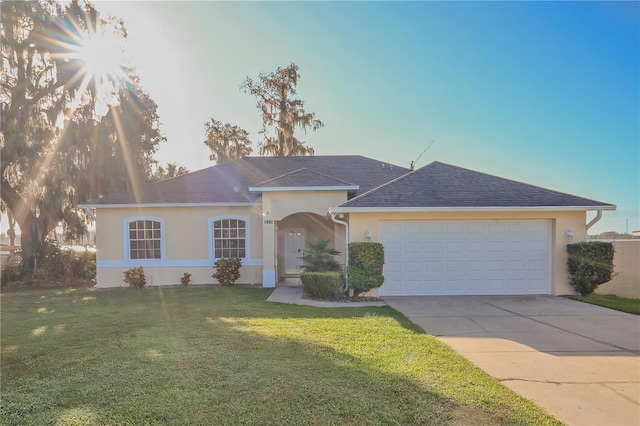 single story home with a garage and a front yard