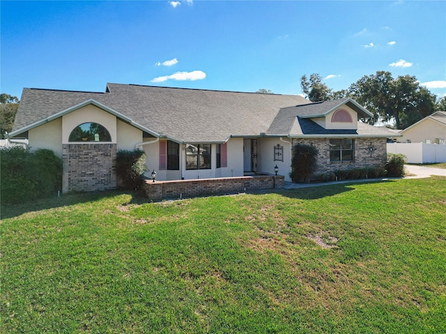 ranch-style house with a front yard