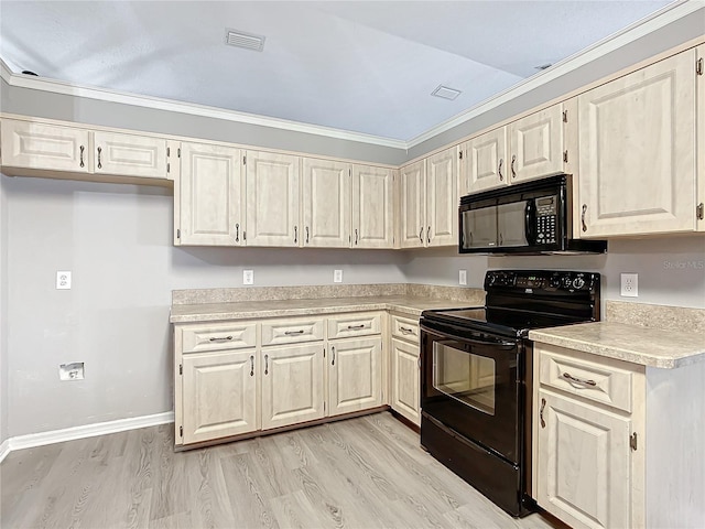 kitchen with light hardwood / wood-style flooring, black appliances, and ornamental molding