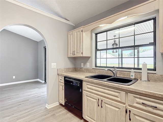 kitchen featuring light wood-type flooring, crown molding, sink, black dishwasher, and lofted ceiling