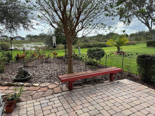 view of home's community featuring a yard and a patio