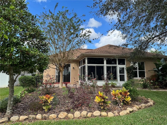 rear view of house with a sunroom