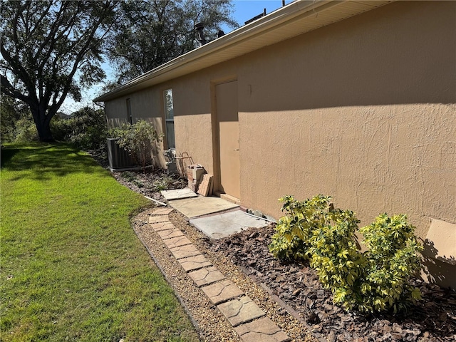 view of home's exterior featuring a yard