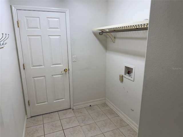 washroom with light tile patterned flooring and washer hookup