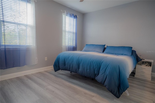 3406 Soho St Unit 102, Orlando, FL 32835 - bedroom with wood finished floors and a ceiling fan