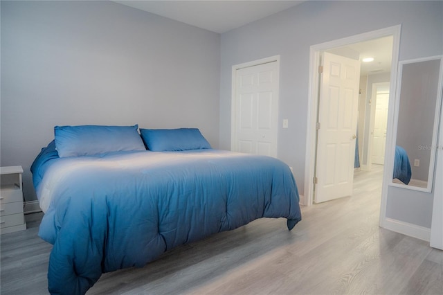 bedroom with light hardwood / wood-style flooring