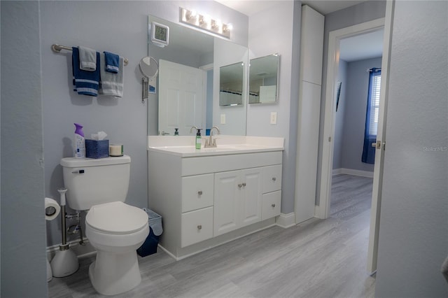 3406 Soho St Unit 102, Orlando, FL 32835 - bathroom featuring wood finished floors and vanity
