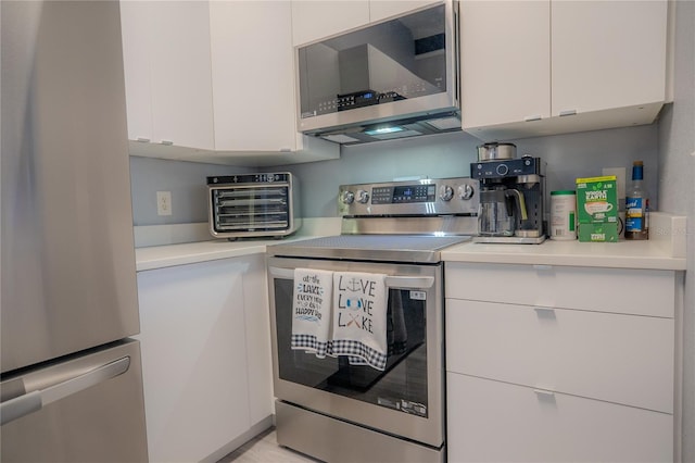 kitchen with white cabinetry and stainless steel appliances