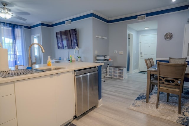 3406 Soho St Unit 102, Orlando, FL 32835 - kitchen featuring stainless steel dishwasher, a ceiling fan, light wood-type flooring, light countertops, and crown molding