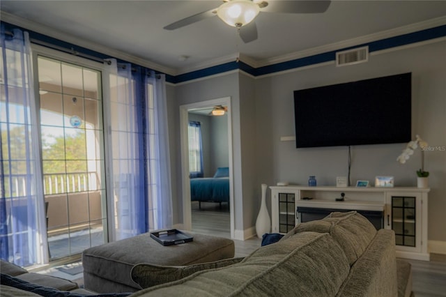3406 Soho St Unit 102, Orlando, FL 32835 - living area featuring ceiling fan, ornamental molding, and wood finished floors