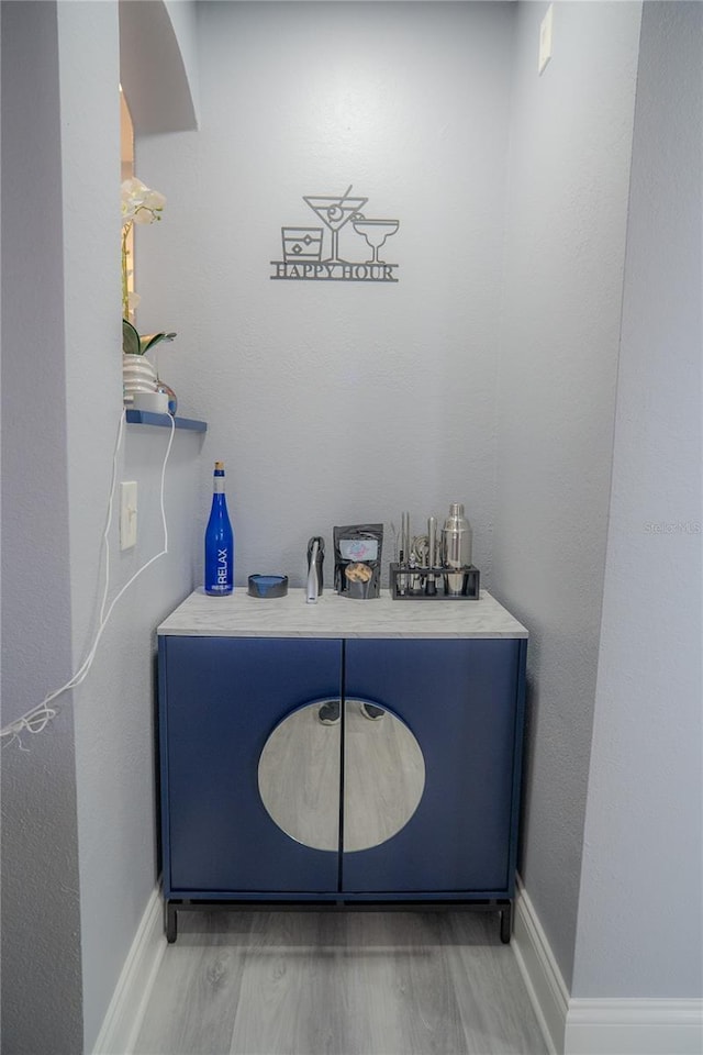 3406 Soho St Unit 102, Orlando, FL 32835 - bar featuring light wood-style flooring and baseboards
