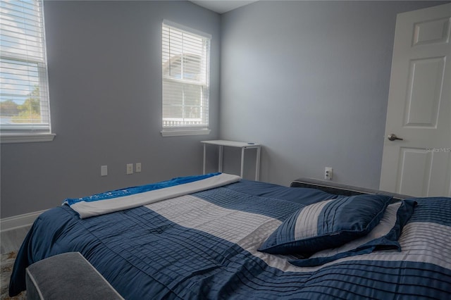 bedroom with multiple windows