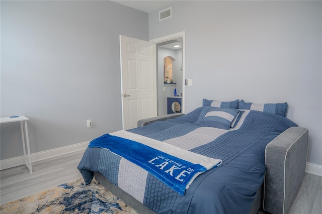 bedroom featuring light wood-type flooring