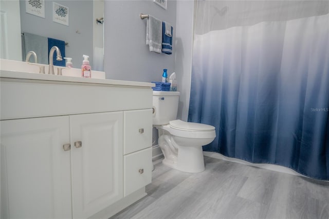 3406 Soho St Unit 102, Orlando, FL 32835 - bathroom with vanity, wood finished floors, and a shower with curtain
