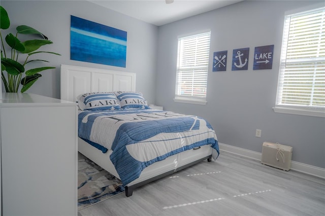 bedroom with hardwood / wood-style flooring