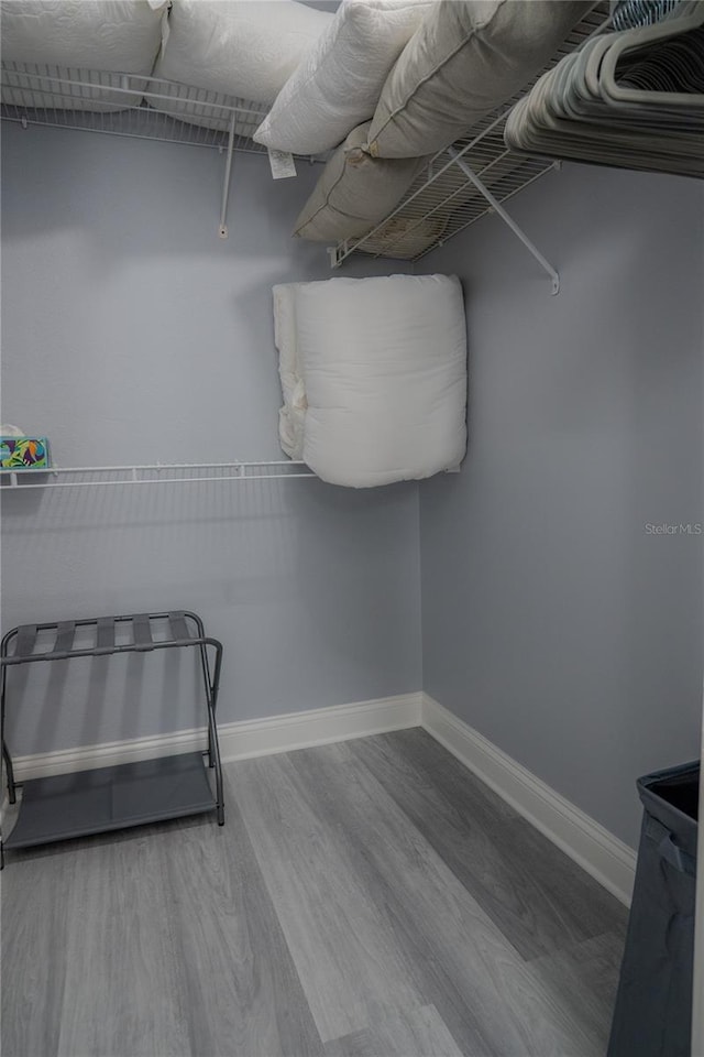 spacious closet featuring hardwood / wood-style floors