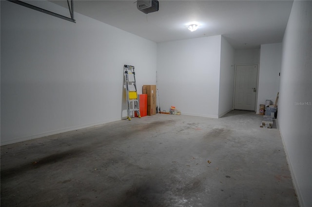3406 Soho St Unit 102, Orlando, FL 32835 - garage with a garage door opener and baseboards
