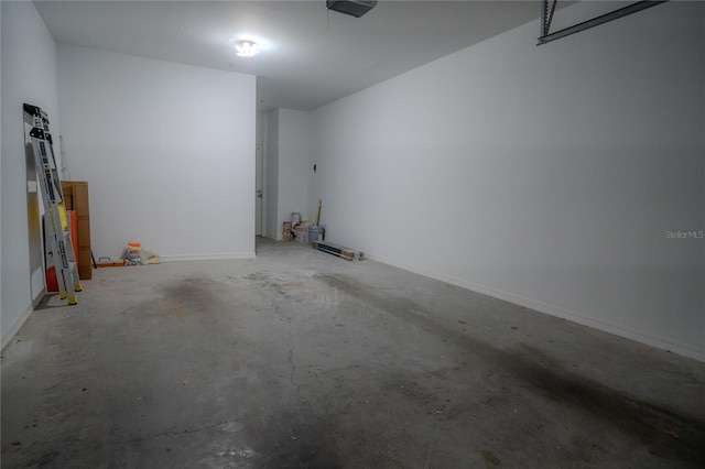 3406 Soho St Unit 102, Orlando, FL 32835 - garage with baseboards