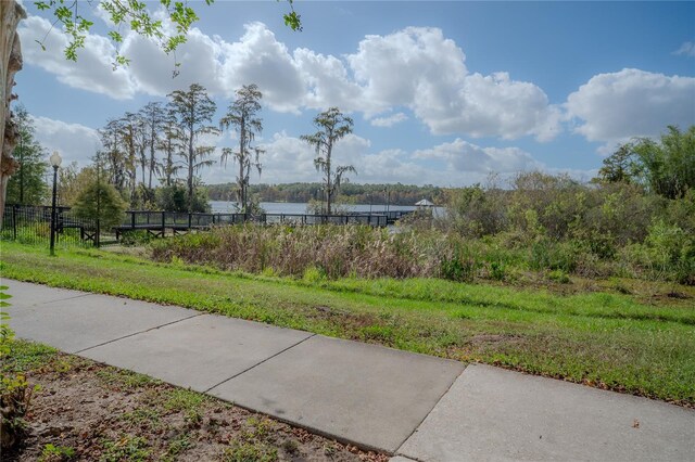 3406 Soho St Unit 102, Orlando, FL 32835 - view of community featuring a water view