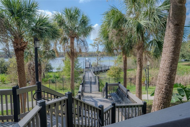 wooden terrace featuring a water view