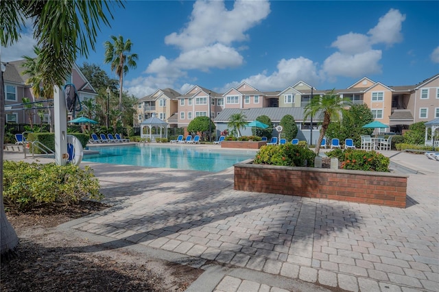 view of swimming pool with a patio