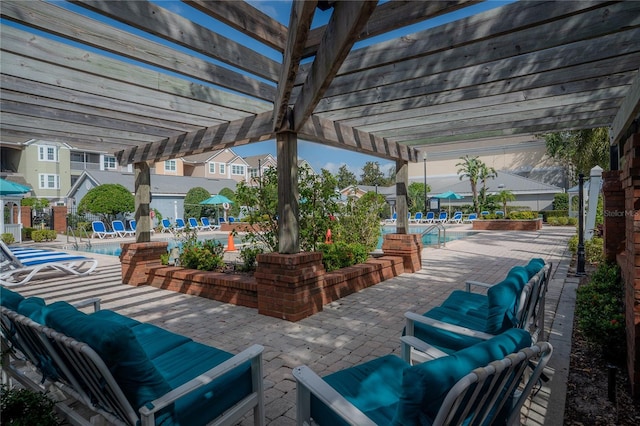 view of patio with an outdoor living space, a pergola, and a community pool