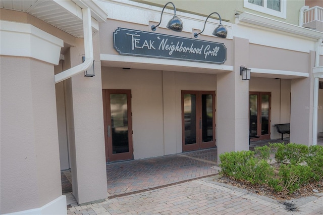 3406 Soho St Unit 102, Orlando, FL 32835 - view of exterior entry with stucco siding
