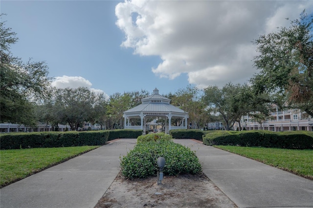 view of property's community with a gazebo and a yard