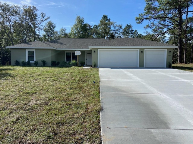 ranch-style home with a garage and a front lawn