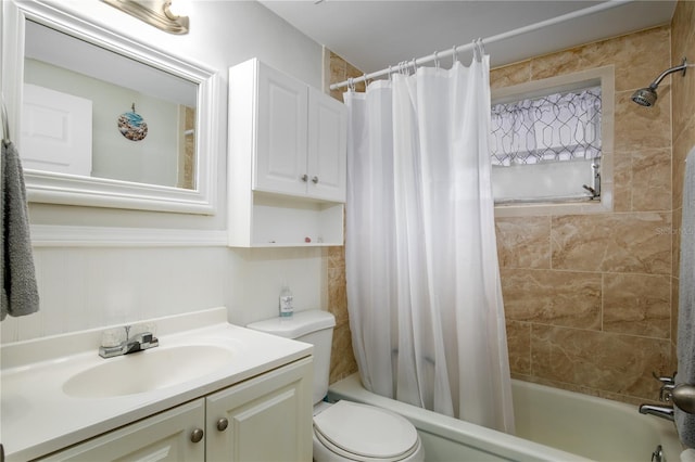 full bathroom with toilet, shower / bathtub combination with curtain, and vanity