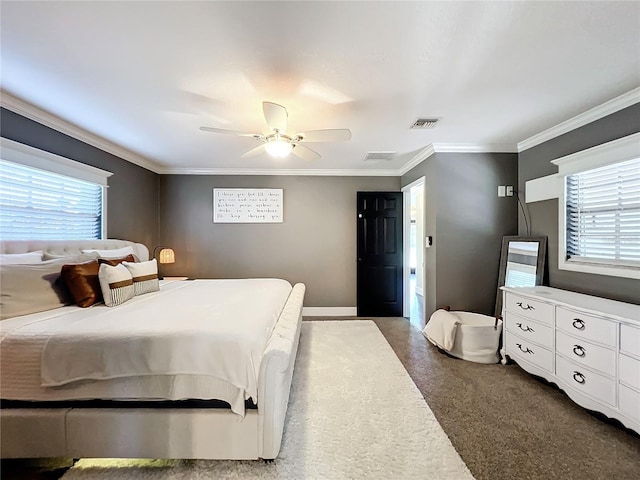 carpeted bedroom featuring ceiling fan and ornamental molding