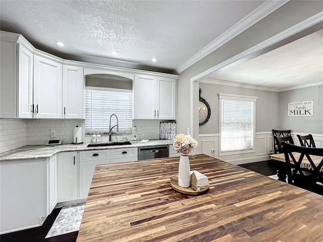 kitchen featuring white cabinets, hardwood / wood-style floors, a wealth of natural light, and sink