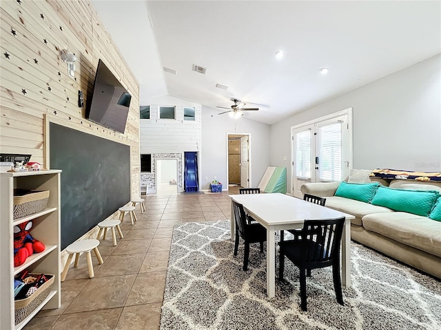 tiled living room with vaulted ceiling and ceiling fan