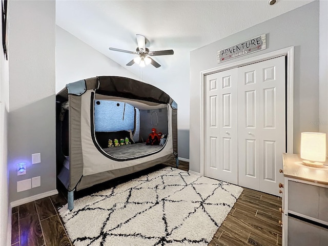 bedroom with ceiling fan, a closet, and dark hardwood / wood-style floors