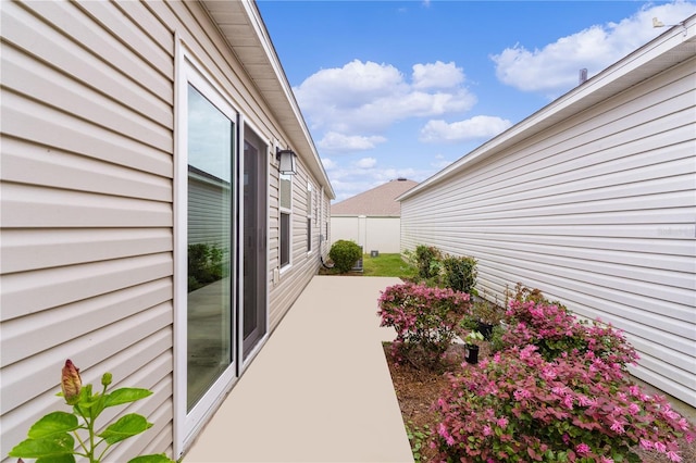 view of side of home with a patio area