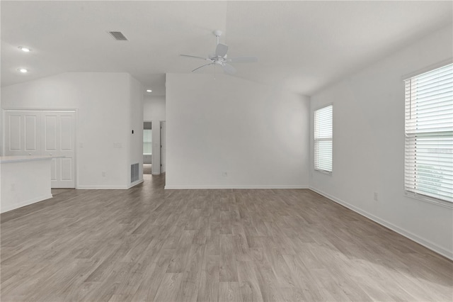 unfurnished living room with ceiling fan, light hardwood / wood-style floors, and lofted ceiling