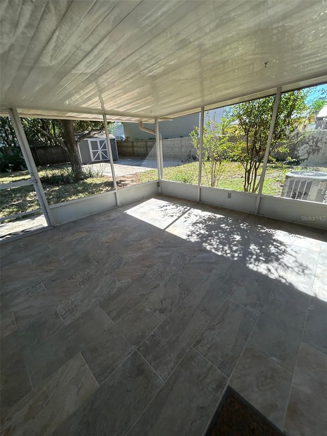 unfurnished sunroom featuring a wealth of natural light