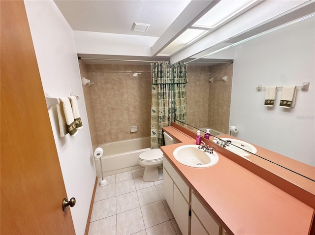 full bathroom with tile patterned flooring, shower / bath combination with curtain, vanity, and toilet