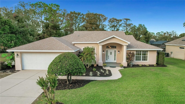 ranch-style house with a front yard and a garage