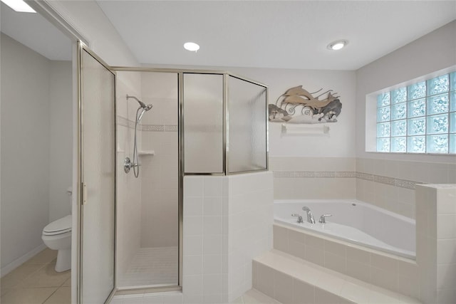 bathroom with tile patterned flooring, toilet, and shower with separate bathtub