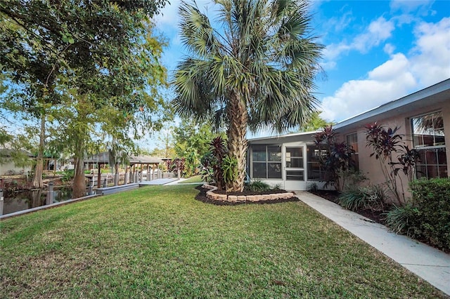 view of yard featuring a sunroom