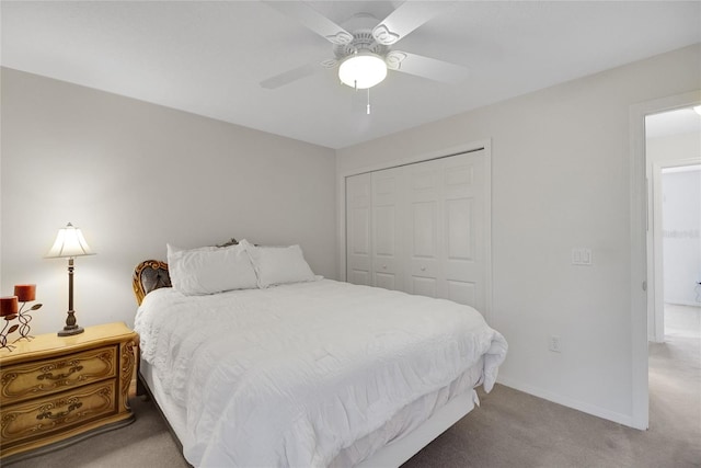 bedroom with carpet, a closet, and ceiling fan