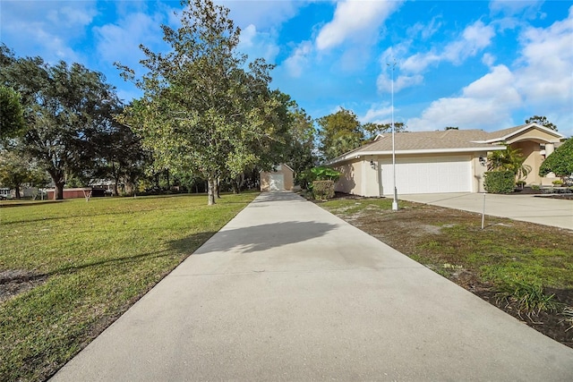 exterior space with a front yard and a garage