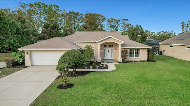 ranch-style house with a front yard and a garage