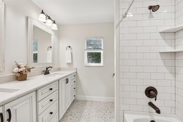 bathroom featuring vanity, tiled shower / bath combo, and tile patterned floors