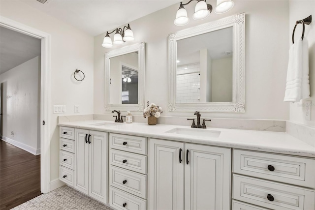 bathroom with hardwood / wood-style flooring and vanity