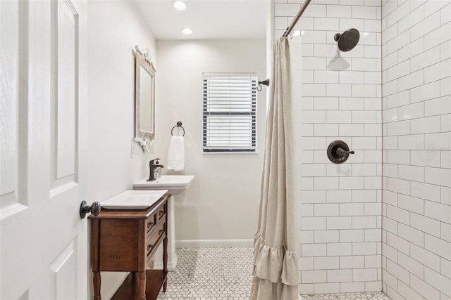 bathroom with tile patterned flooring and walk in shower