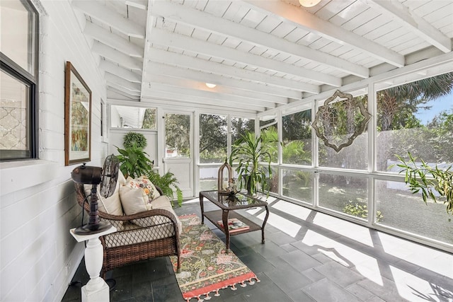 sunroom with beamed ceiling, plenty of natural light, and wood ceiling